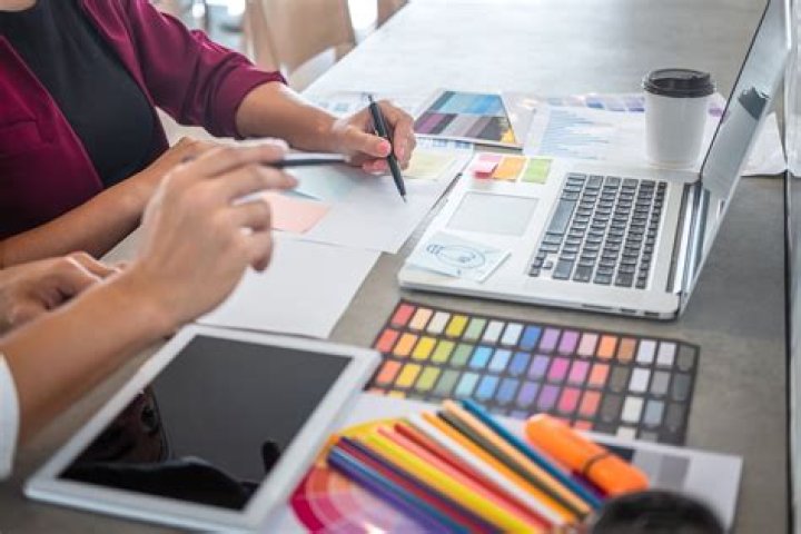 Do graphic designers work for companies?