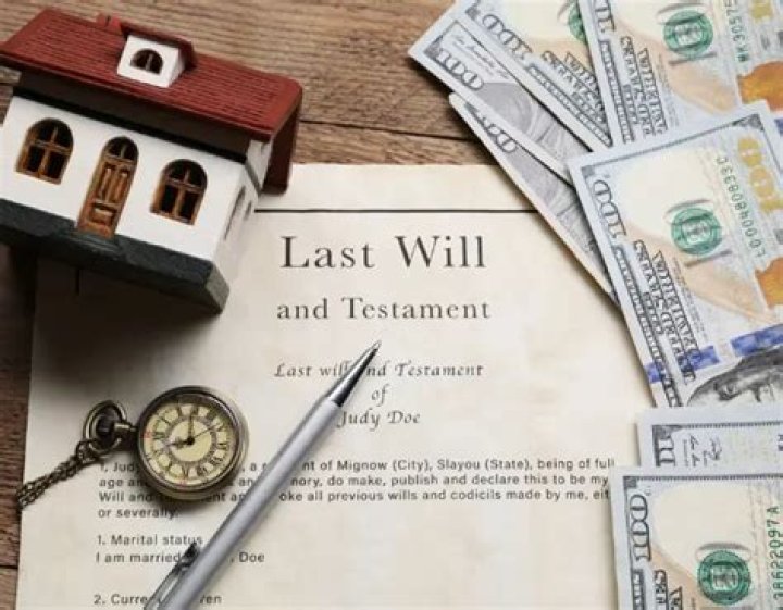How is real property conveyed to heirs when a person dies without a will?