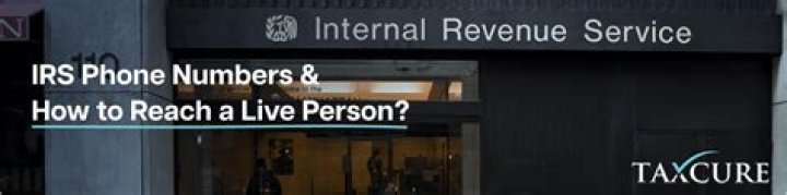 What number do I call to get a real person at the IRS?